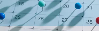 Colored pins on the calendar.
