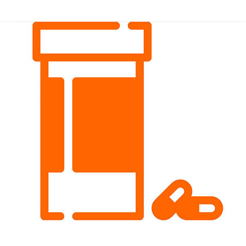 An orange prescription bottle with two pills lying beside it. 